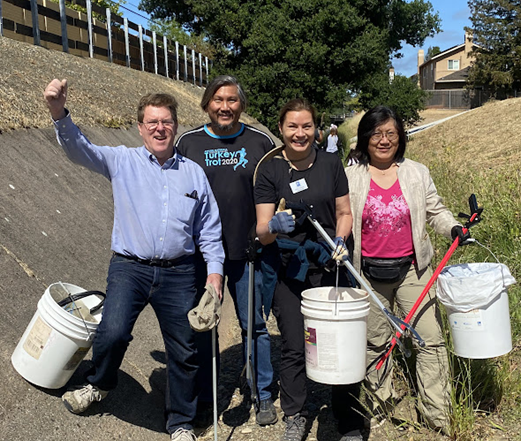 Liang Chao and fellow councilmembers at a creek cleanup
